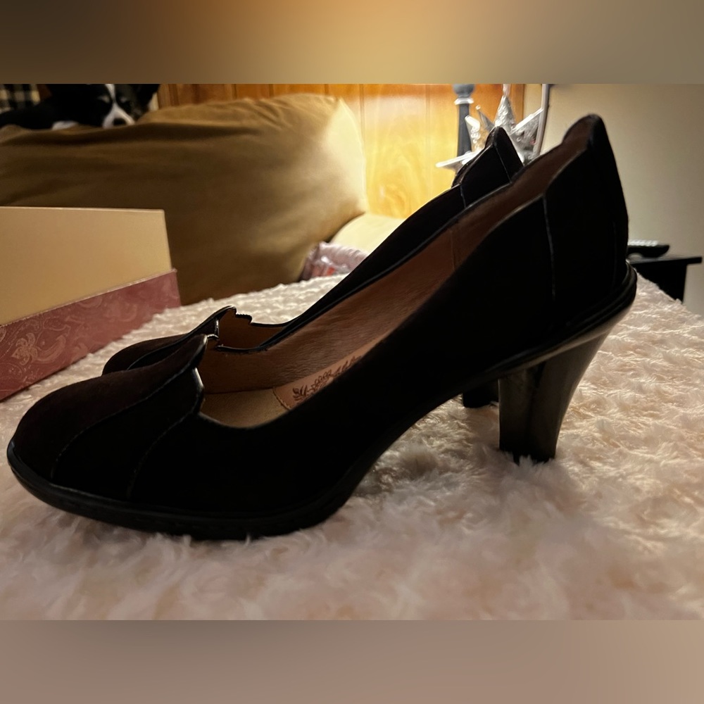 New in box. Suede chocolate brown heels. Scalloped edges in front and back.